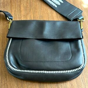 Hamimi leather saddle bag with w embroidered adjustable strap.